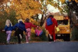 Kids running to school bus