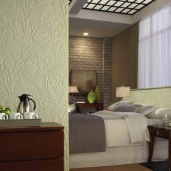 Bedroom with Fasade wall panels Nettle in Fern color are an alternative to wall murals