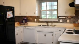 Aspect Peel & Stick tiles in stone update this kitchen. 